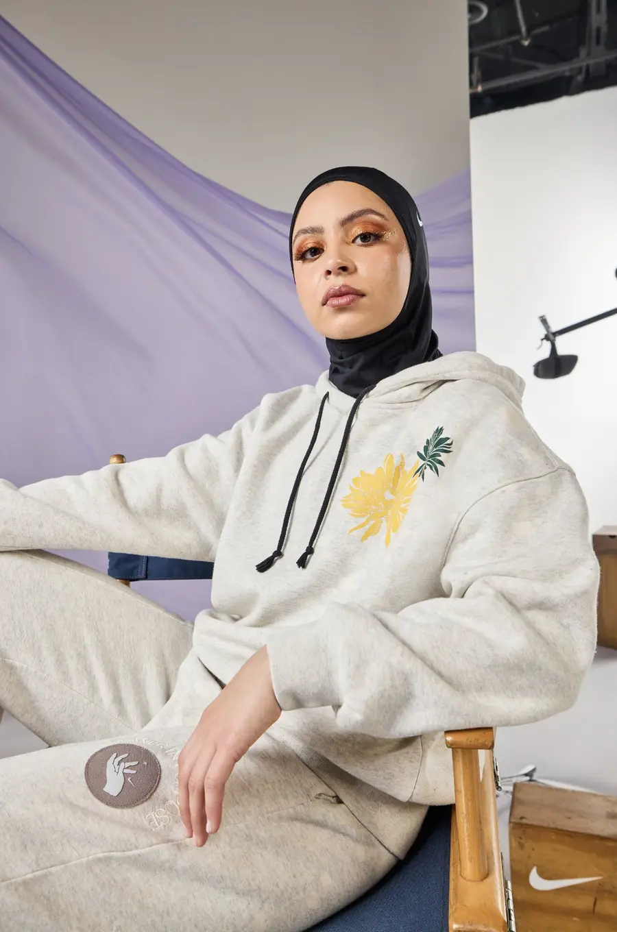 A woman in a hoodie for Nike